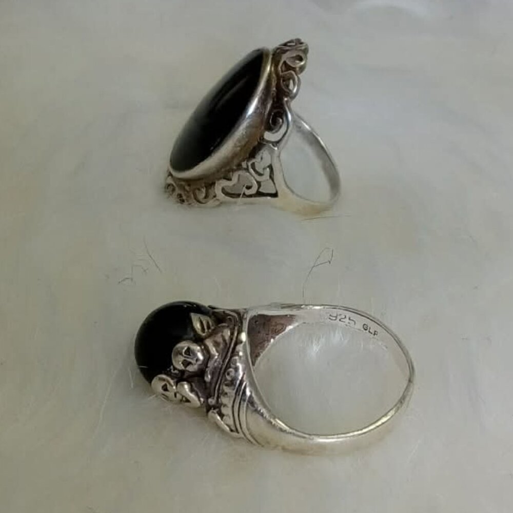 Two vintage rings with black inlays, one silver, 90's
